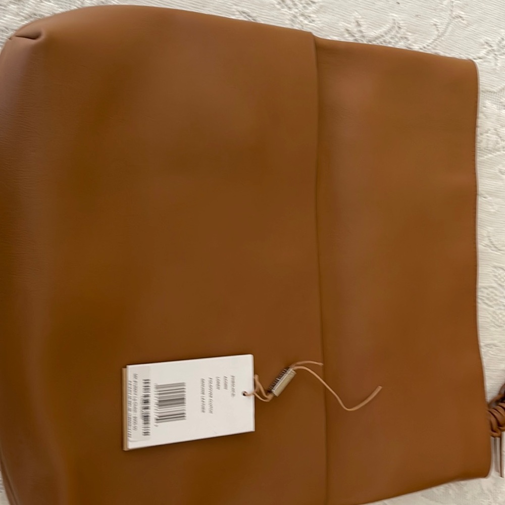 Michael Kor’s Loren fold over clutch acorn color